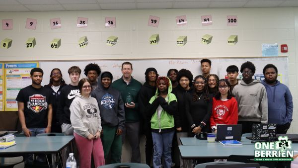 Mr. Roberts is congratulated by his students.