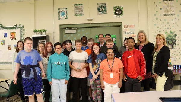 Ms. Vorrath is congratulated by her students and colleagues.