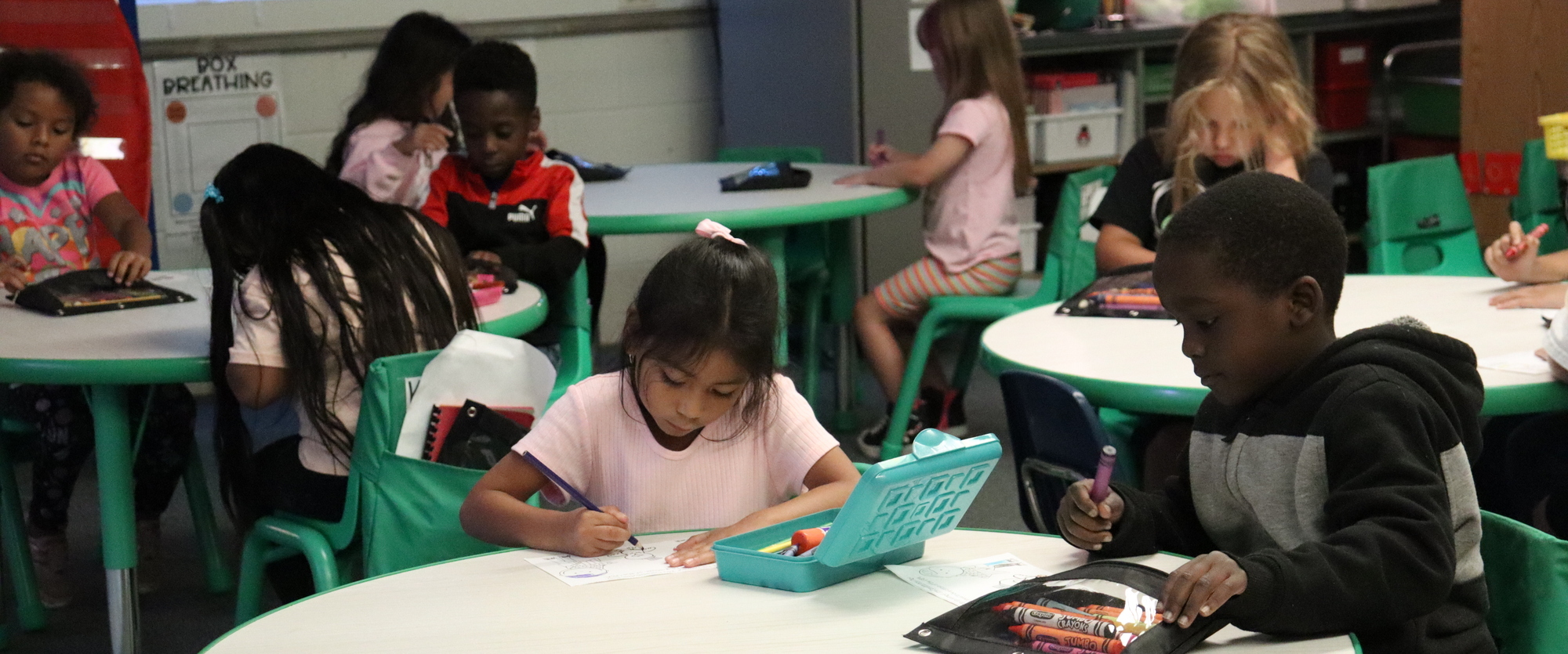 Kindergarten students are engaged in their learning.